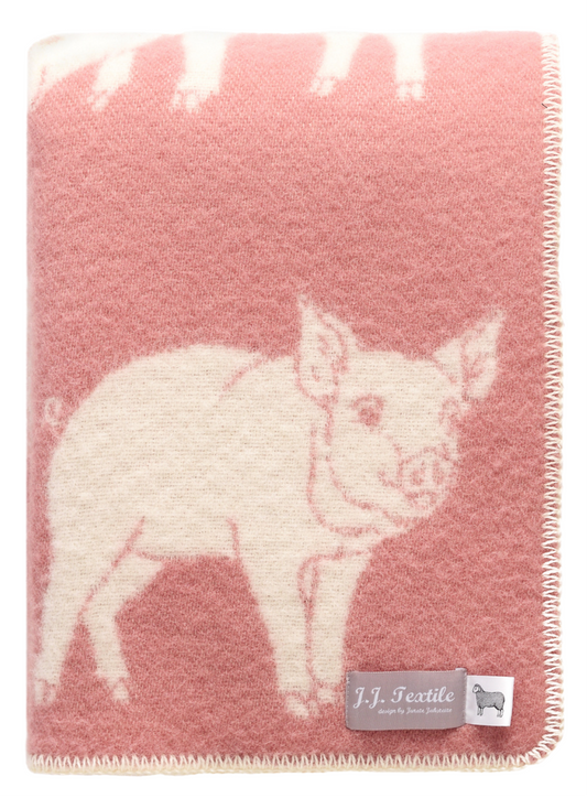 Pink blanket with a pig design and J.J. Textile label.