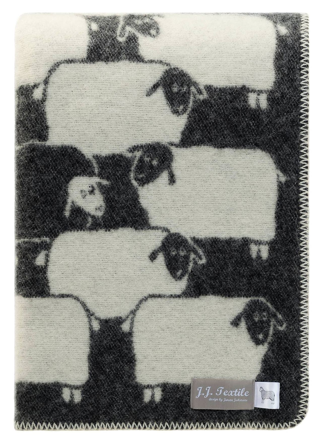 Blanket with a pattern of sheep on a black background, featuring the brand 'J.F. Textile'.